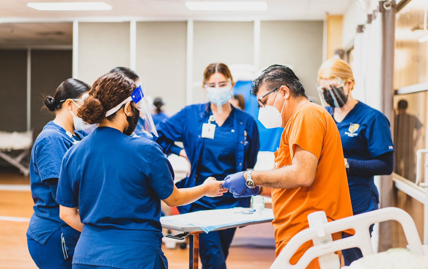 Rio Grande Valley College nursing students practicing a clinical skill in a simulation lab.